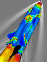 Airplane Picture - SSLV at Mach 2.46 and 66,000 ft (20,000 m). The surface of the vehicle is colored by the pressure coefficient, and the gray contours represent the density of the surrounding air, as calculated using the overflow codes.