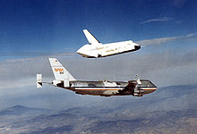 Airplane Picture - OV-101 Enterprise takes flight for the first time over Dryden Flight Research Facility, Edwards, California in 1977 as part of the Shuttle program's Approach and Landing Tests (ALT).
