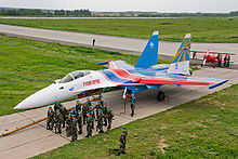 Airplane Picture - A Russian Knights Su-35 accompanied by Russian Airborne Troops.