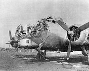 Airplane Pictures - B-17G-80BO 43-38172 8th AF 398th BG 601st BS damaged on bombing mission over Cologne, Germany on 15 October 1944. Pilot 1st Lt. Lawrence De Lancey brought the wounded Fortress back to Nuthampstead, UK, where photo was taken. Notice the upwards effect of the anti-aircraft shell; the bombardier S/Sgt. George E. Abbott was killed.