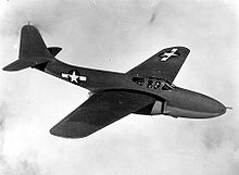 Airplane Picture - Bell YP-59A in flight. X and Y aircraft had rounded vertical stabilizers and wingtips while the production A and B models had squared surfaces. The YP-59A can be distinguished from the XP-59A because Ys had nose armament.