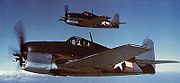 Airplane Pictures - Grumman F6F-3 Hellcats in tricolor camouflage, red outline on US insignia indicate picture was taken circa June - September 1943