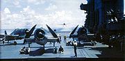 Airplane Pictures - Grumman F6F-3 Hellcats on the flight deck with wings folded, Grumman Avenger on landing approach