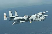 Warbird Picture - Carolinas Aviation Museum OV-1D Mohawk 874 in flight over Stanley County,NC 2006